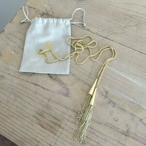 Kendra Scott long gold chain with tassels.